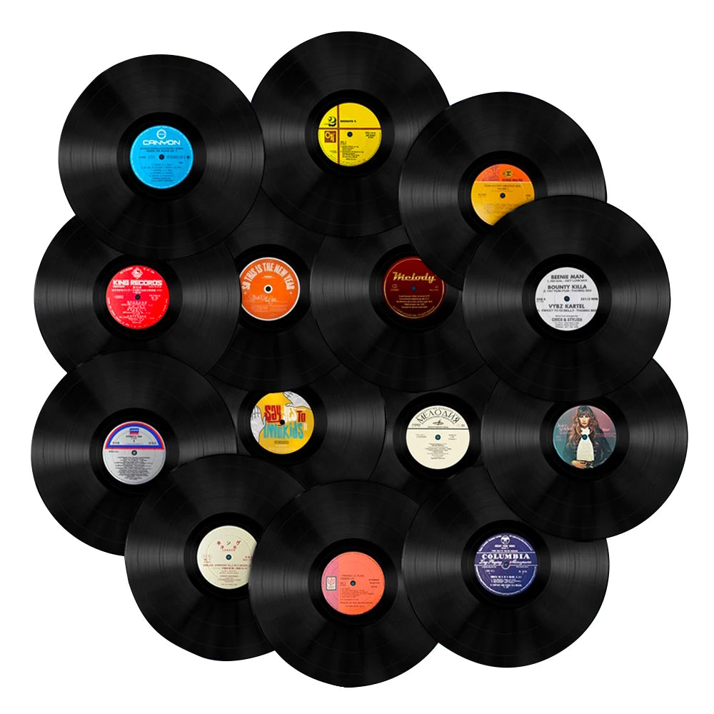 Collection of vinyl records arranged in a circular pattern on a white background