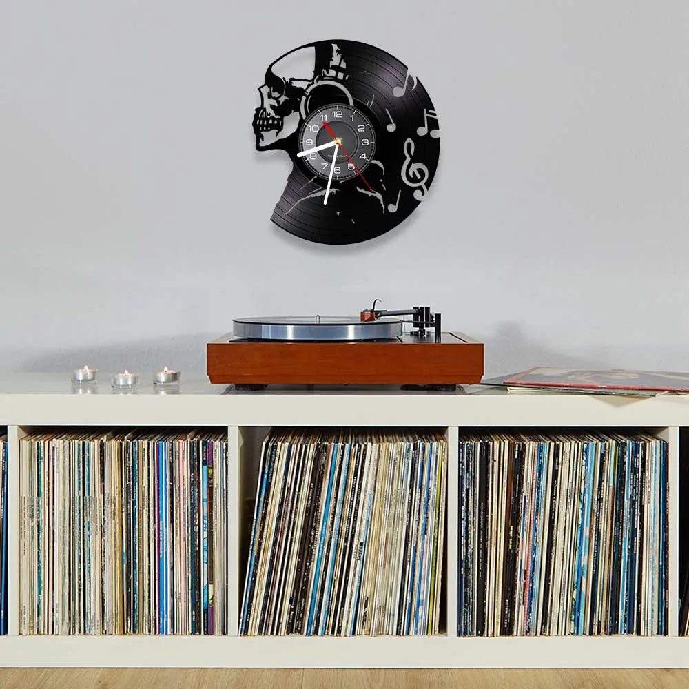 Music Never Dies Skull Vinyl Record Wall Clock showing precision-cut design - unique retro clock for man cave and music room - staged above records and record player