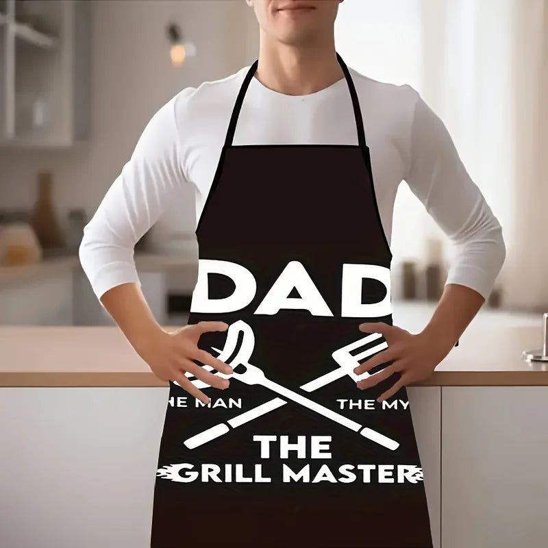 Dad The Grill Master BBQ Apron showing waterproof fabric, pockets and adjustable straps - funny grill apron model