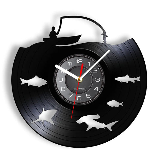 Fishing vinyl record wall clock featuring intricate laser-cut design with swimming fish silhouettes circling around clock face on black vinyl record