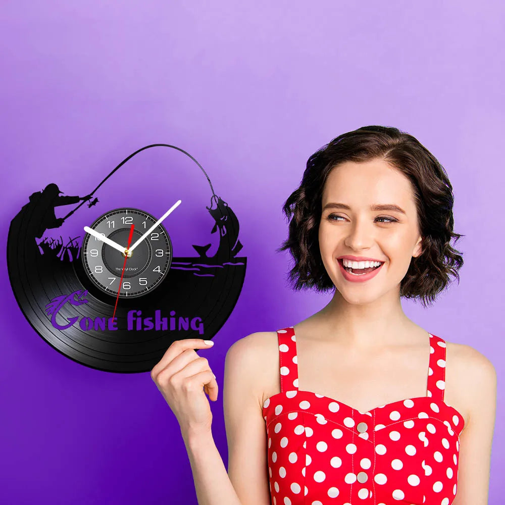 Model holding fishing vinyl record wall clock example showing size and display