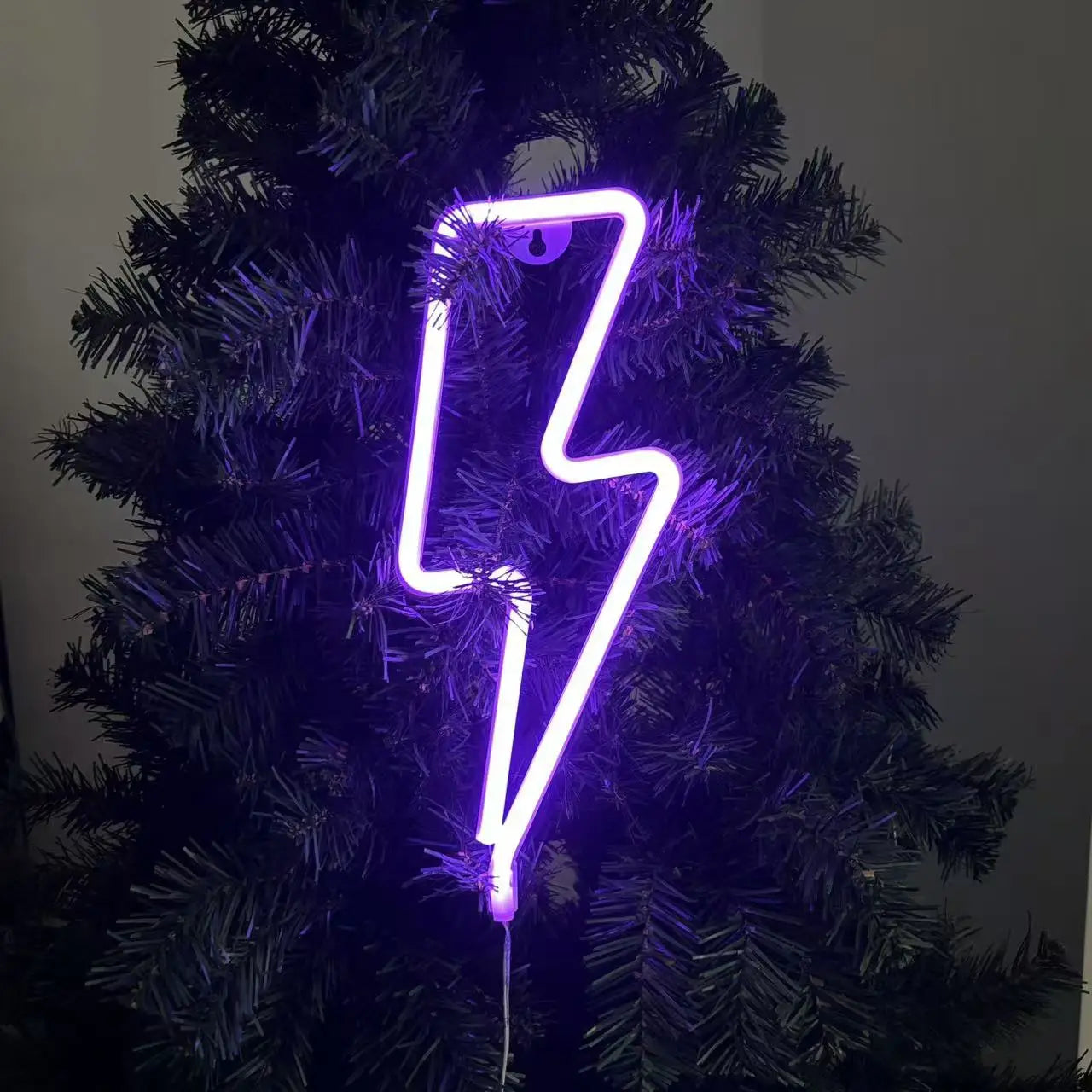 Lightning bolt neon sign in purple featuring vibrant violet glow