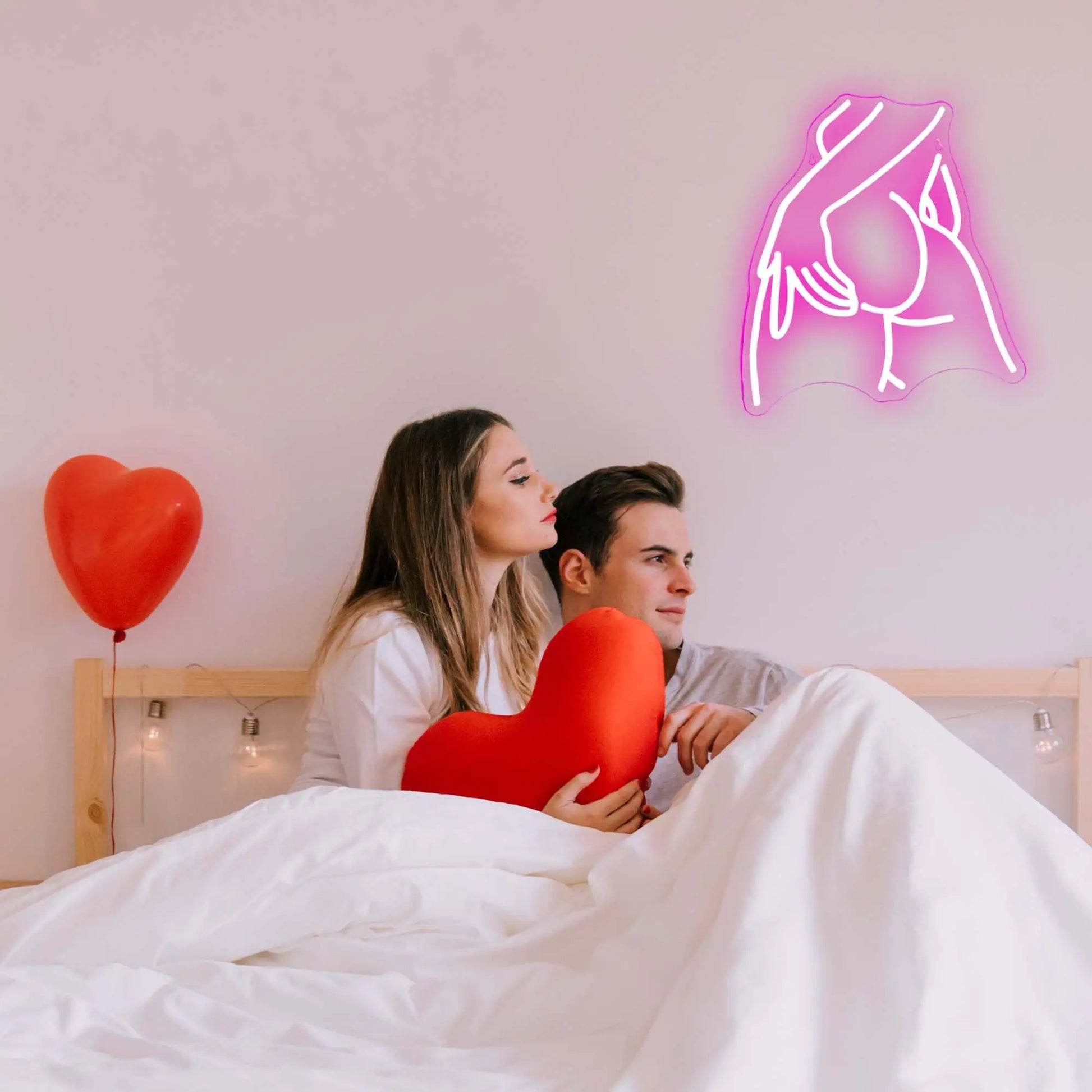 Curvy woman silhouette pink neon sign lifestyle shot showing bedroom wall installation with romantic ambient lighting