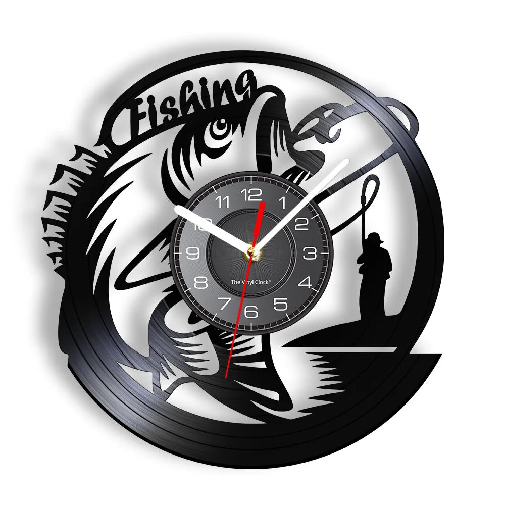 Fishing vinyl record wall clock featuring intricate laser-cut design with large bass fish jumping out of water, fisherman in boat casting line, cattails and water plants, and bold FISHING text on black vinyl record