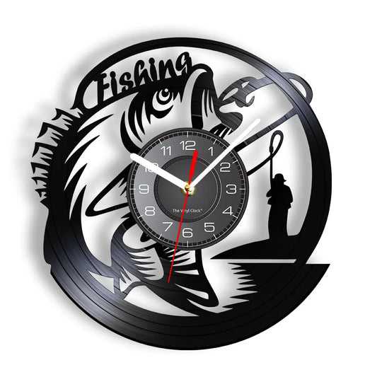 Fishing vinyl record wall clock featuring intricate laser-cut design with large bass fish jumping out of water, fisherman in boat casting line, cattails and water plants, and bold FISHING text on black vinyl record