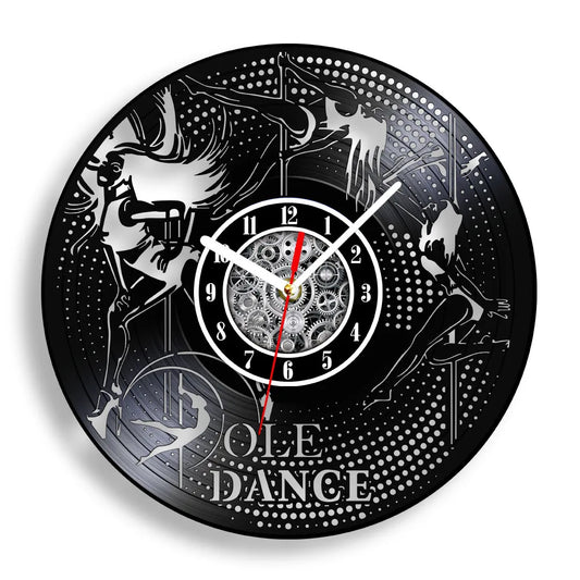 Pole Dance vinyl record wall clock featuring intricate laser-cut dancer silhouette performing on pole with graceful poses, POLE DANCE text, and decorative stars on black vinyl record