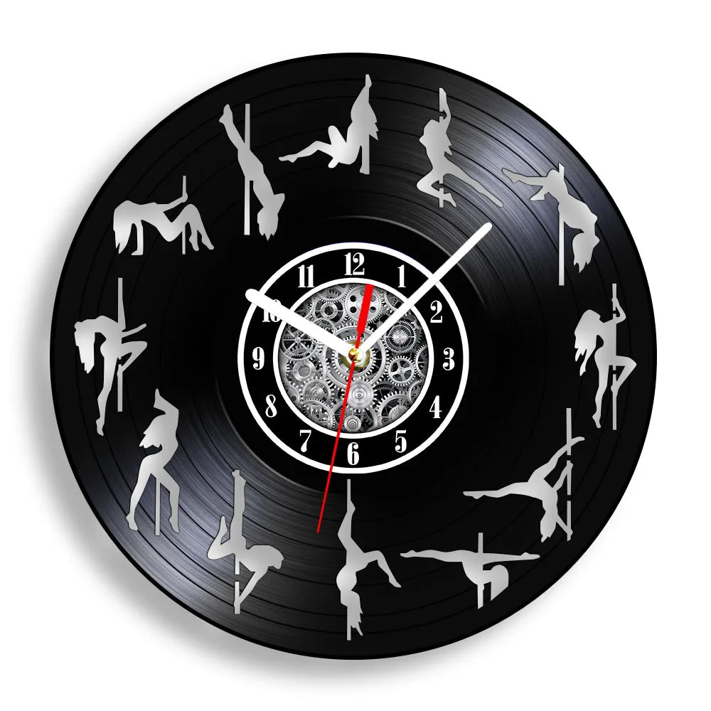 Pole Dance vinyl record wall clock featuring intricate laser-cut design with multiple dancer silhouettes performing various graceful poses on pole around clock face on black vinyl record example