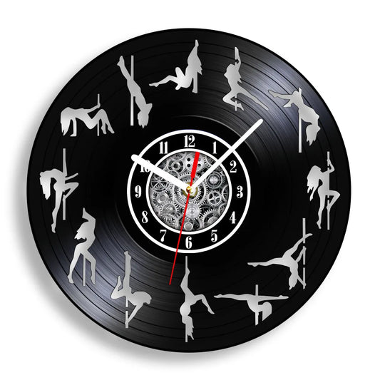 Pole Dance vinyl record wall clock featuring intricate laser-cut design with multiple dancer silhouettes performing various graceful poses on pole around clock face on black vinyl record example